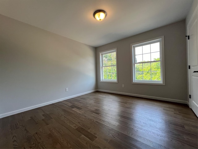 96 Baybright Dr, Shirley, NY 11967 - spare room with dark wood finished floors and baseboards