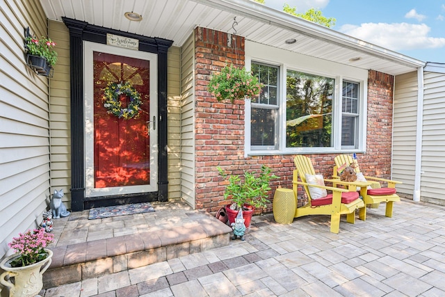 11 Kim Ave, Smithtown, NY 11787 - property entrance featuring a porch and brick siding