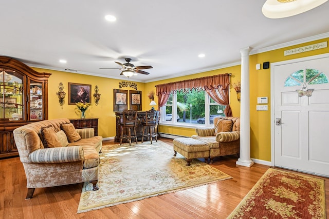 11 Kim Ave, Smithtown, NY 11787 - living area with decorative columns, crown molding, wood finished floors, recessed lighting, and a ceiling fan