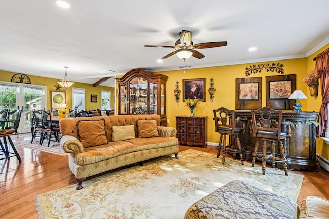 11 Kim Ave, Smithtown, NY 11787 - living room featuring ceiling fan, recessed lighting, wood finished floors, and crown molding