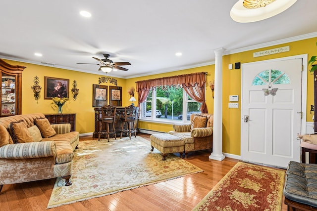 11 Kim Ave, Smithtown, NY 11787 - living area with decorative columns, wood-type flooring, crown molding, recessed lighting, and a ceiling fan