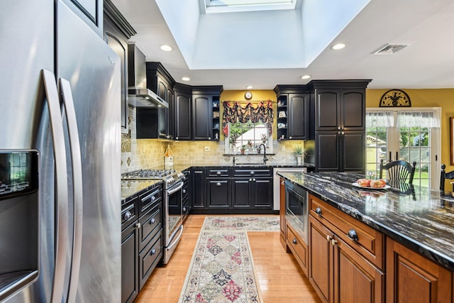 11 Kim Ave, Smithtown, NY 11787 - kitchen featuring appliances with stainless steel finishes, open shelves, wall chimney exhaust hood, dark stone counters, and recessed lighting