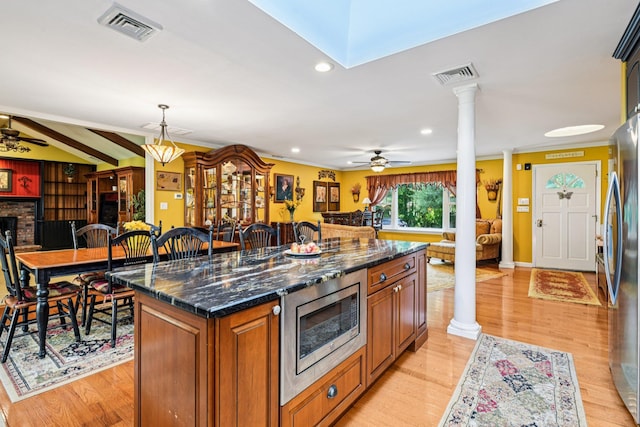 11 Kim Ave, Smithtown, NY 11787 - kitchen featuring ornate columns, stainless steel appliances, open floor plan, a ceiling fan, and recessed lighting