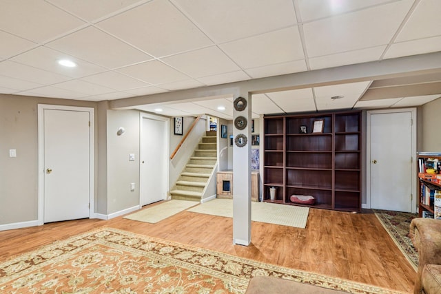 11 Kim Ave, Smithtown, NY 11787 - finished below grade area with wood finished floors, a paneled ceiling, stairway, and recessed lighting