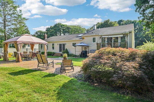 11 Kim Ave, Smithtown, NY 11787 - rear view of property with a gazebo, a chimney, a lawn, and a patio area