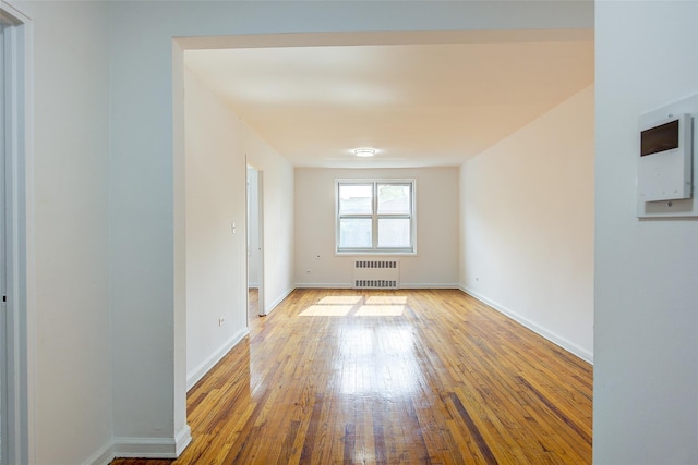 34-15 74th St Unit 5K, Jackson Heights, NY 11372 - unfurnished room featuring radiator and hardwood / wood-style floors