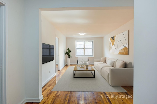 34-15 74th St Unit 5K, Jackson Heights, NY 11372 - living room with wood finished floors and baseboards