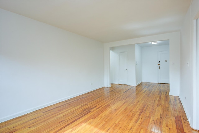 34-15 74th St Unit 5K, Jackson Heights, NY 11372 - spare room featuring light wood-style flooring and baseboards