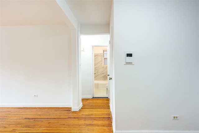 34-15 74th St Unit 5K, Jackson Heights, NY 11372 - corridor featuring light wood finished floors and baseboards