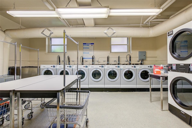 34-15 74th St Unit 5K, Jackson Heights, NY 11372 - shared laundry featuring stacked washer / dryer, washing machine and dryer, and plenty of natural light
