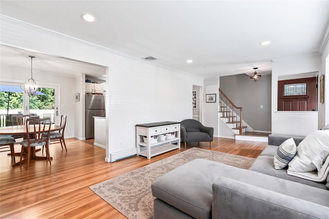 15 Chambers Ct, Huntington Station, NY 11746 - living room with a chandelier, crown molding, stairs, light wood-style flooring, and recessed lighting