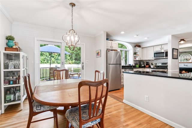 15 Chambers Ct, Huntington Station, NY 11746 - dining room with a chandelier, light wood-style flooring, ornamental molding, and recessed lighting