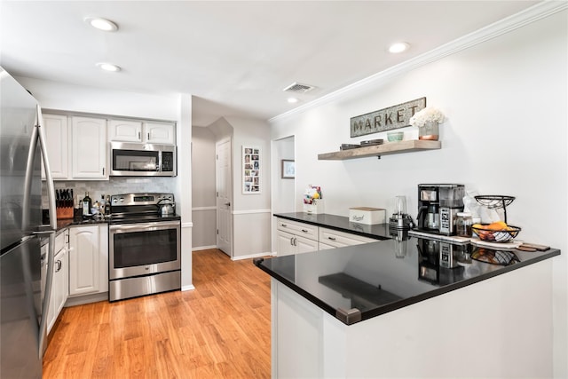 15 Chambers Ct, Huntington Station, NY 11746 - kitchen featuring appliances with stainless steel finishes, dark countertops, crown molding, open shelves, and light wood-style floors