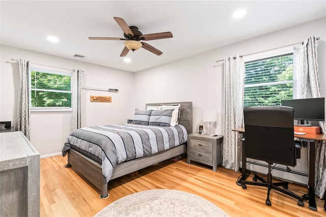 15 Chambers Ct, Huntington Station, NY 11746 - bedroom featuring wood finished floors, an office area, recessed lighting, a baseboard radiator, and ceiling fan