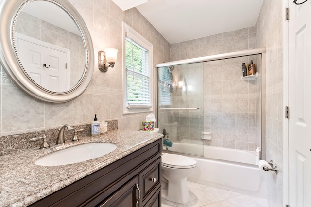 15 Chambers Ct, Huntington Station, NY 11746 - bathroom featuring vanity, tile walls, shower / bath combination with glass door, and tile patterned flooring