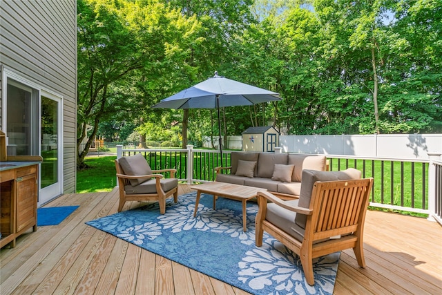 15 Chambers Ct, Huntington Station, NY 11746 - wooden terrace featuring a fenced backyard, a storage unit, an outdoor hangout area, and view of wooded area