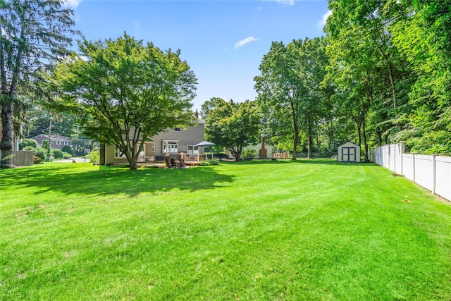 15 Chambers Ct, Huntington Station, NY 11746 - fenced backyard with a storage shed and a wooden deck