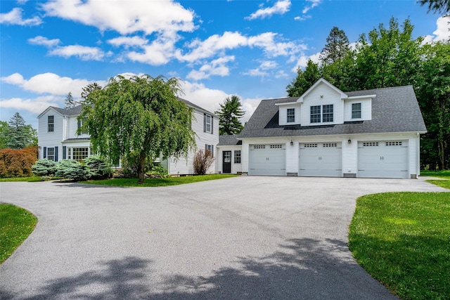 14 Flower Hill Rd, Poughkeepsie, NY 12603 - view of front facade featuring a garage and a front yard