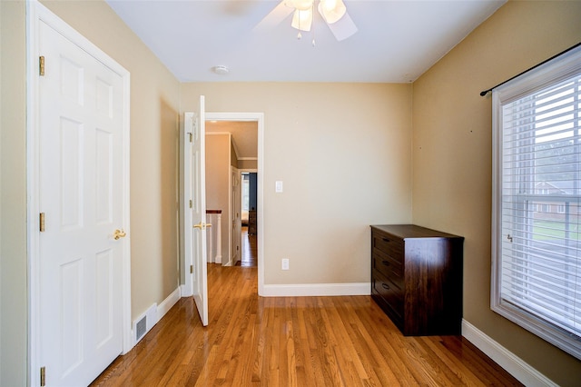 14 Flower Hill Rd, Poughkeepsie, NY 12603 - unfurnished bedroom with light wood-style flooring and ceiling fan