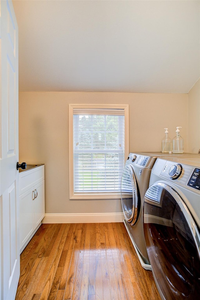 14 Flower Hill Rd, Poughkeepsie, NY 12603 - washroom featuring washer and dryer, cabinet space, and wood finished floors