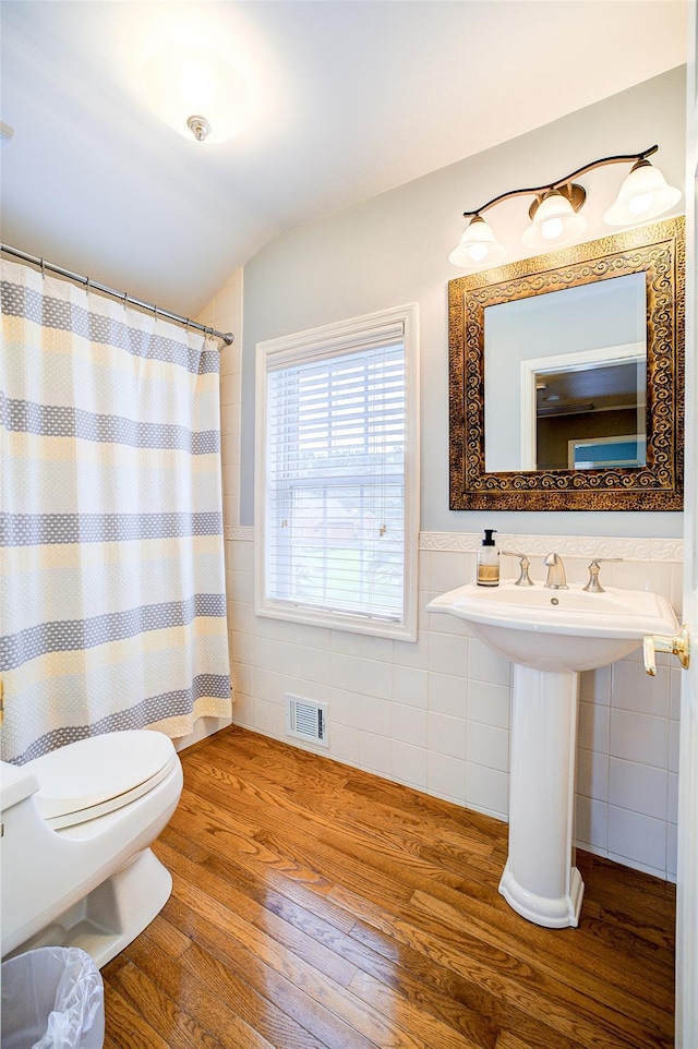14 Flower Hill Rd, Poughkeepsie, NY 12603 - bathroom with tile walls, wood finished floors, wainscoting, and curtained shower
