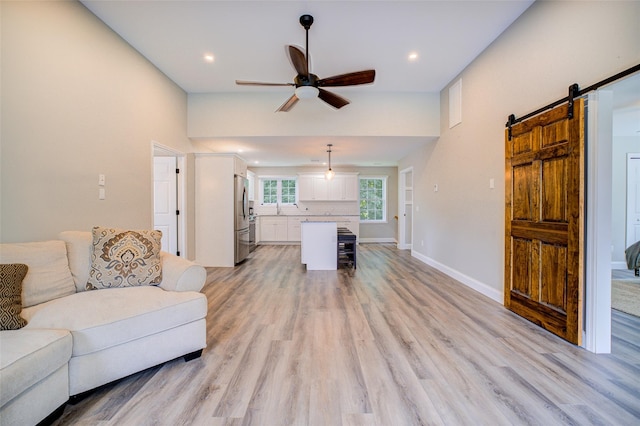 14 Flower Hill Rd, Poughkeepsie, NY 12603 - living room with ceiling fan, a barn door, light wood-style flooring, and recessed lighting