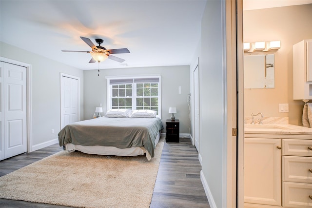 14 Flower Hill Rd, Poughkeepsie, NY 12603 - bedroom featuring multiple closets, wood finished floors, ensuite bath, and ceiling fan