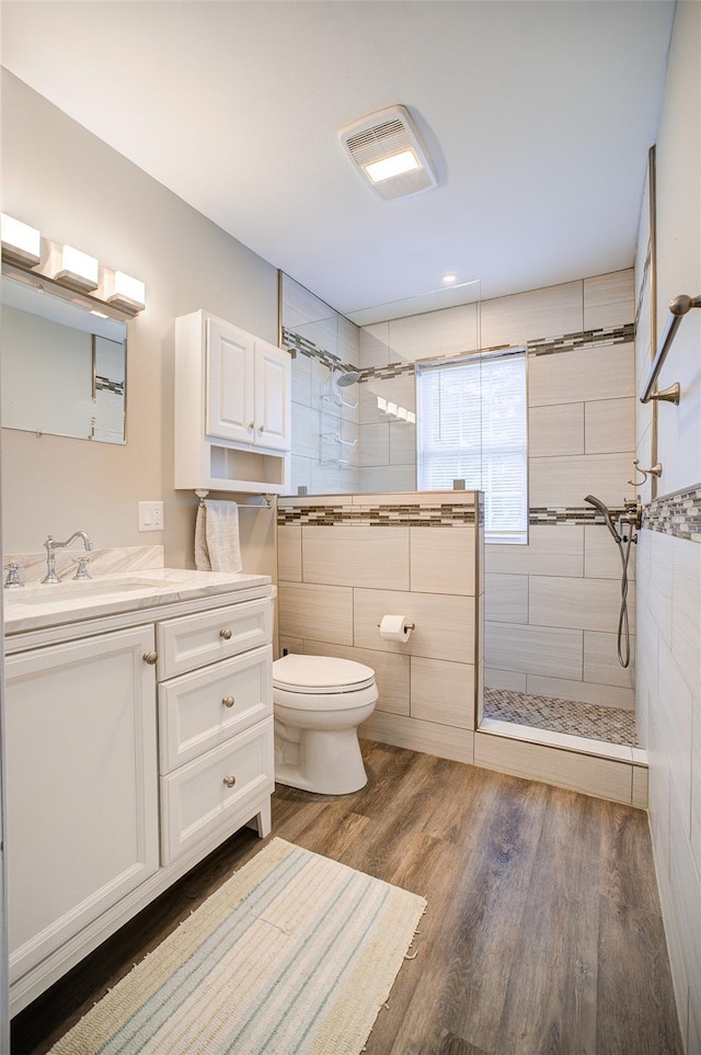 14 Flower Hill Rd, Poughkeepsie, NY 12603 - bathroom with wood finished floors, vanity, and a walk in shower