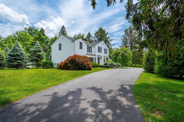 14 Flower Hill Rd, Poughkeepsie, NY 12603 - view of front of home with driveway, a front yard, and a chimney