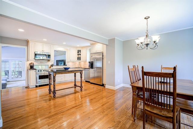 14 Flower Hill Rd, Poughkeepsie, NY 12603 - dining room with a chandelier, light wood-style flooring, ornamental molding, and recessed lighting