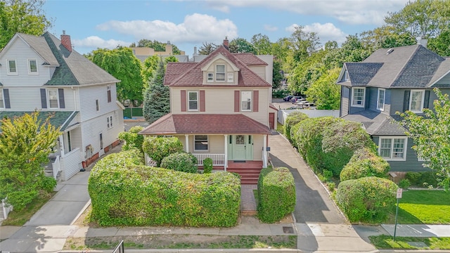 108 N Forest Ave, Rockville Centre, NY 11570 - victorian home featuring a porch and a residential view
