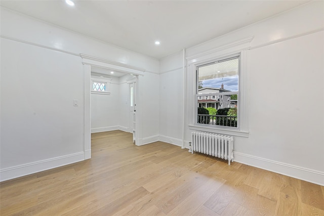 108 N Forest Ave, Rockville Centre, NY 11570 - empty room with radiator heating unit, light wood finished floors, and recessed lighting
