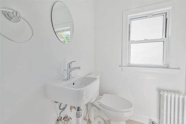108 N Forest Ave, Rockville Centre, NY 11570 - bathroom featuring radiator heating unit and toilet
