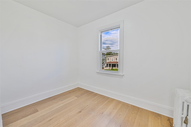 108 N Forest Ave, Rockville Centre, NY 11570 - unfurnished room with light wood finished floors and radiator heating unit