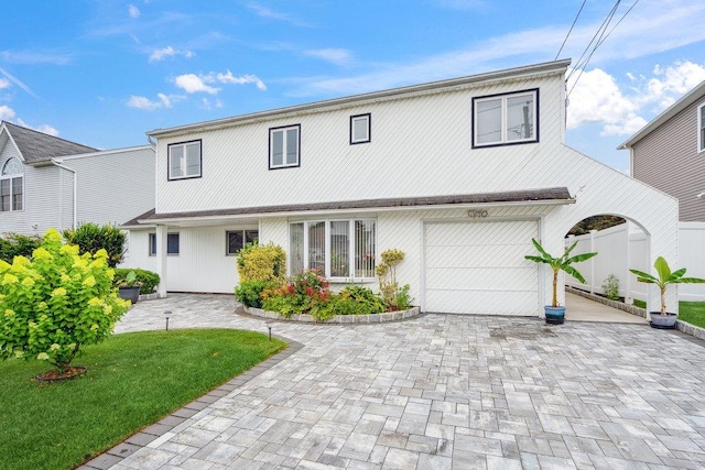 11 Sunrise St, Plainview, NY 11803 - traditional home with an attached garage and driveway