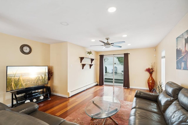 11 Sunrise St, Plainview, NY 11803 - living area featuring baseboard heating, wood finished floors, a ceiling fan, and recessed lighting