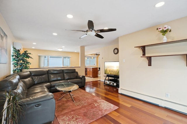 11 Sunrise St, Plainview, NY 11803 - living room with a baseboard radiator, wood finished floors, a ceiling fan, and recessed lighting