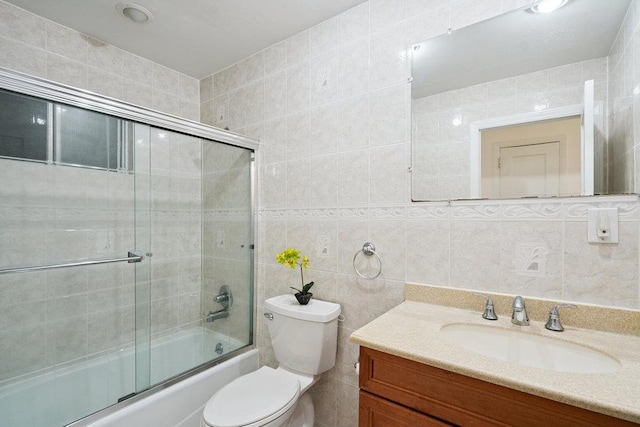 11 Sunrise St, Plainview, NY 11803 - bathroom featuring tile walls, vanity, and bath / shower combo with glass door