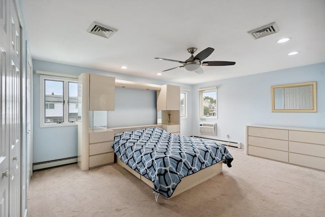 11 Sunrise St, Plainview, NY 11803 - bedroom with baseboard heating, light carpet, recessed lighting, an AC wall unit, and a ceiling fan