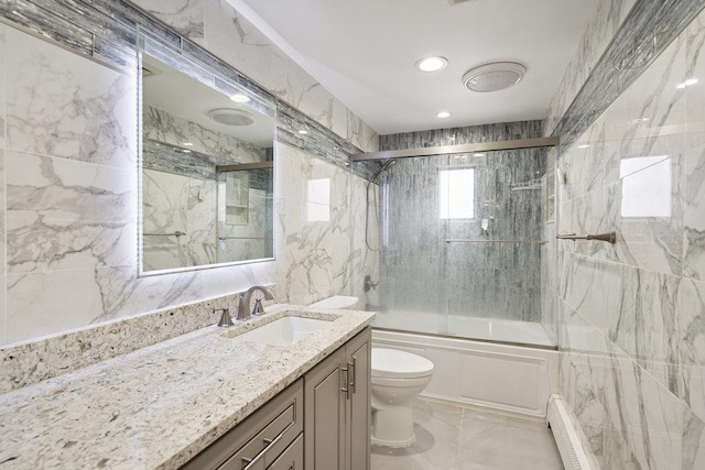 11 Sunrise St, Plainview, NY 11803 - bathroom featuring bath / shower combo with glass door, vanity, marble finish floors, a baseboard radiator, and tile walls
