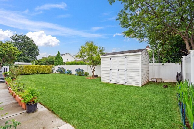 11 Sunrise St, Plainview, NY 11803 - fenced backyard featuring a storage shed