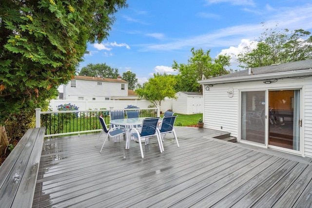 11 Sunrise St, Plainview, NY 11803 - deck featuring outdoor dining space and a storage shed