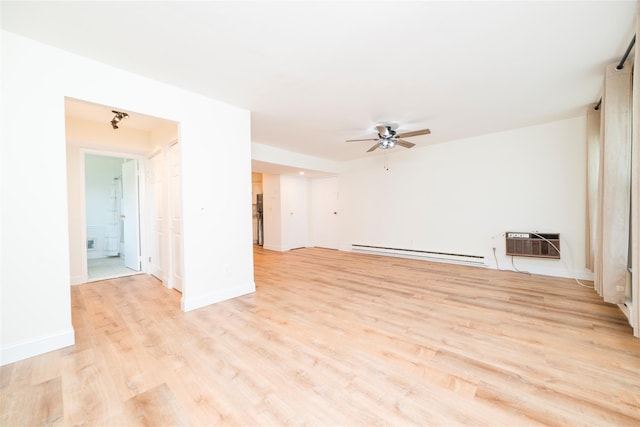27A Walden Ct Unit A, Yorktown Heights, NY 10598 - unfurnished living room featuring a baseboard radiator, a ceiling fan, a wall unit AC, and light wood-style flooring