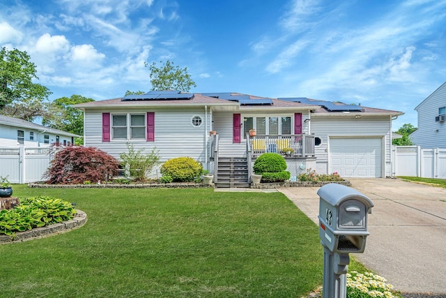 43 Ranch Dr, Shirley, NY 11967 - view of front of property with an attached garage, concrete driveway, and solar panels