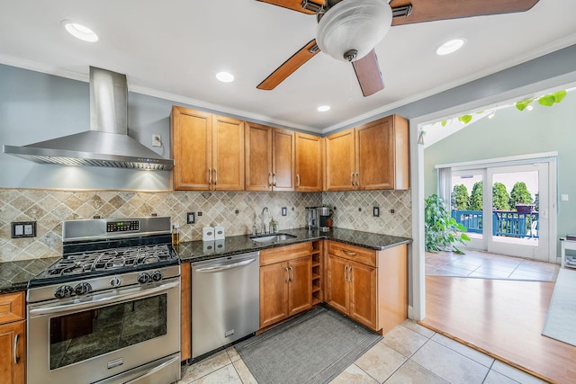 43 Ranch Dr, Shirley, NY 11967 - kitchen with stainless steel appliances, wall chimney exhaust hood, light tile patterned floors, dark stone countertops, and decorative backsplash