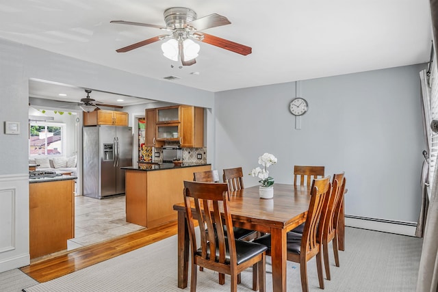 43 Ranch Dr, Shirley, NY 11967 - dining room featuring baseboard heating, ceiling fan, light wood-style floors, and recessed lighting