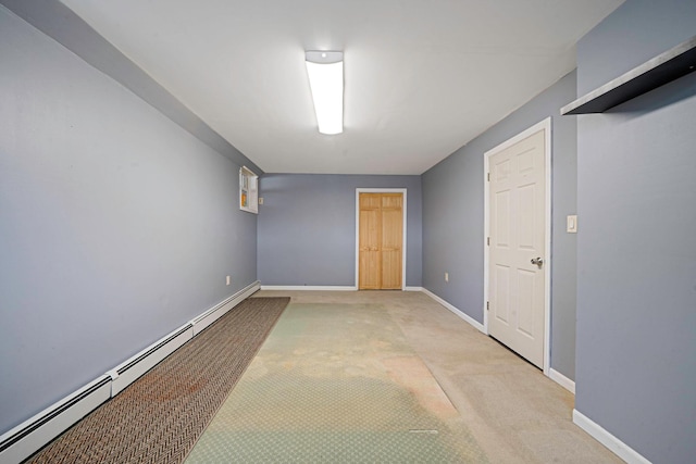 43 Ranch Dr, Shirley, NY 11967 - finished basement with a baseboard heating unit and light colored carpet