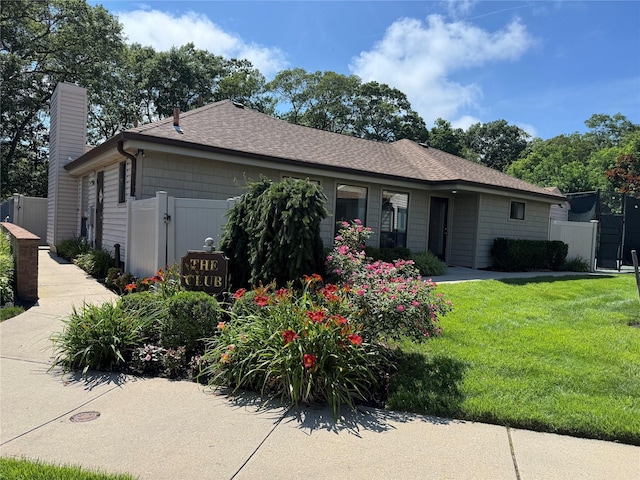 1 Stanford Ct Unit 1, Wantagh, NY 11793 - view of front of house with a chimney and roof with shingles
