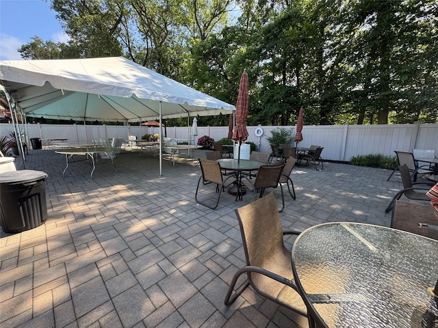 1 Stanford Ct Unit 1, Wantagh, NY 11793 - fenced backyard featuring outdoor dining area and a patio