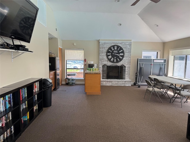 1 Stanford Ct Unit 1, Wantagh, NY 11793 - living area with carpet flooring, a fireplace, high vaulted ceiling, and ceiling fan